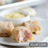 bite taken from a chicken cordon bleu nugget to show inside