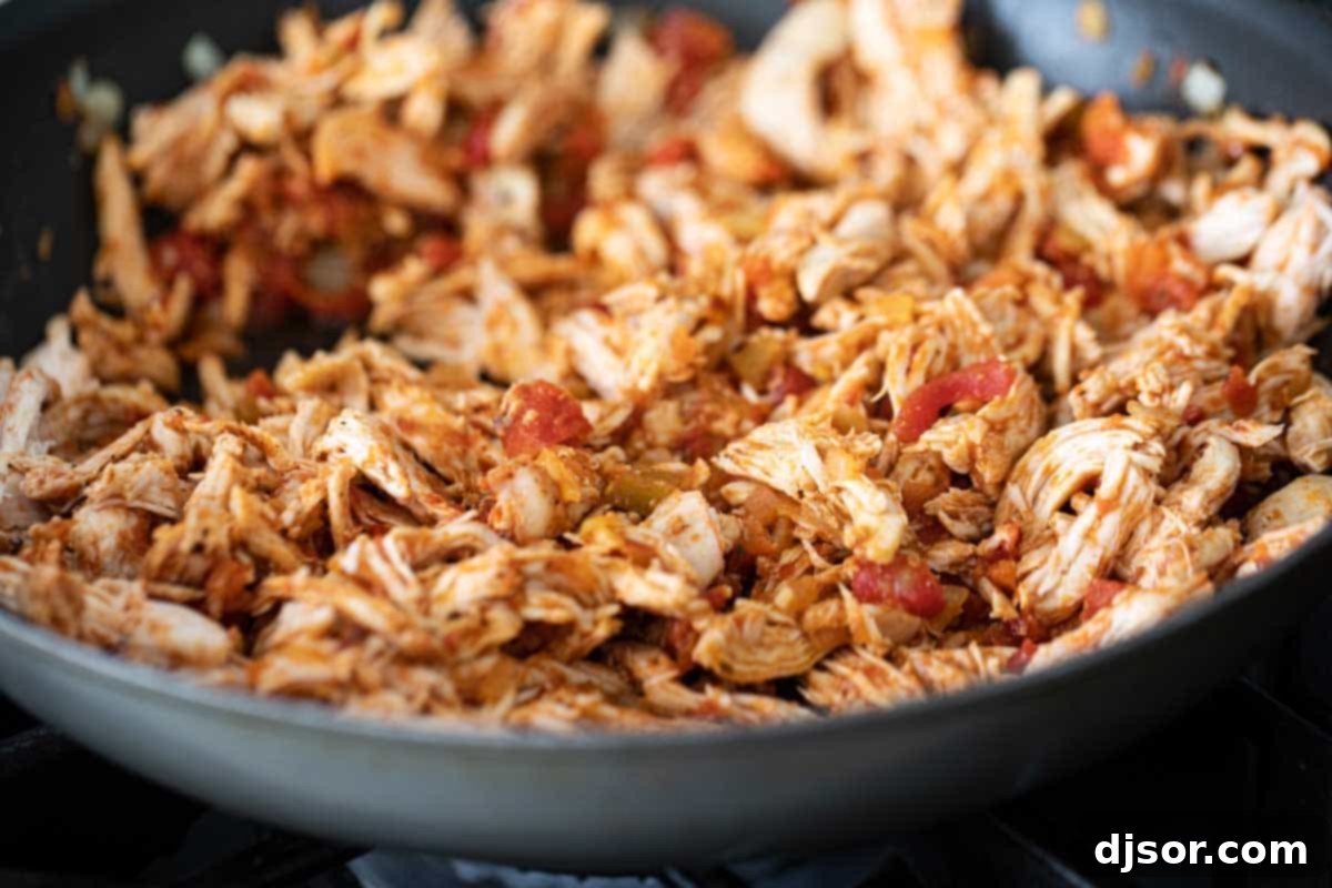 chicken and beans chimichanga filling being prepared