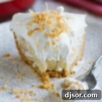 Coconut Cream Pie 2 fork with bite of coconut cream pie