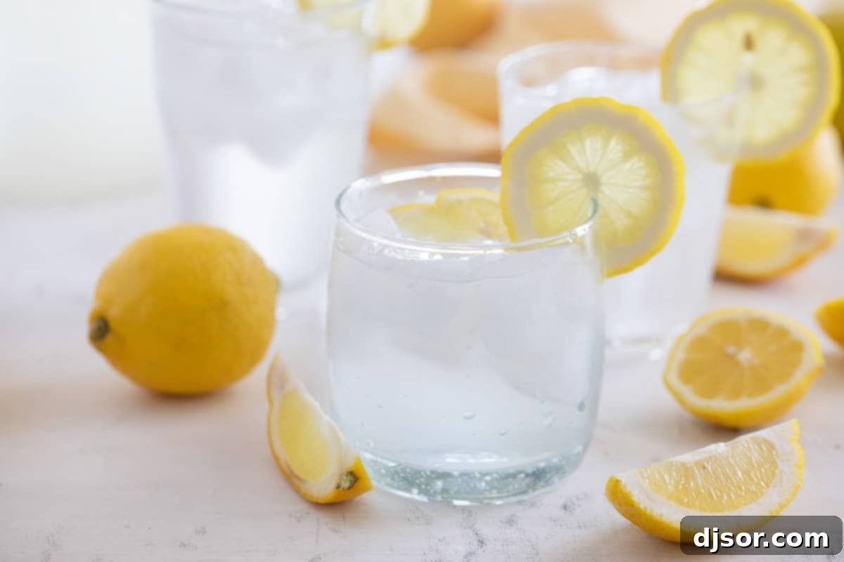 Sweet Lemon Refreshment 2 A refreshing glass of Sweet Lemon Water garnished with a vibrant lemon slice, ready to be enjoyed.