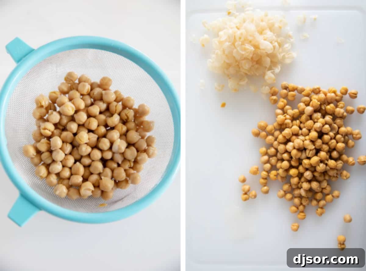Preparing chickpeas for blending into the roasted red pepper hummus. Drained and rinsed chickpeas in a bowl, with the option to remove skins for smoother hummus.