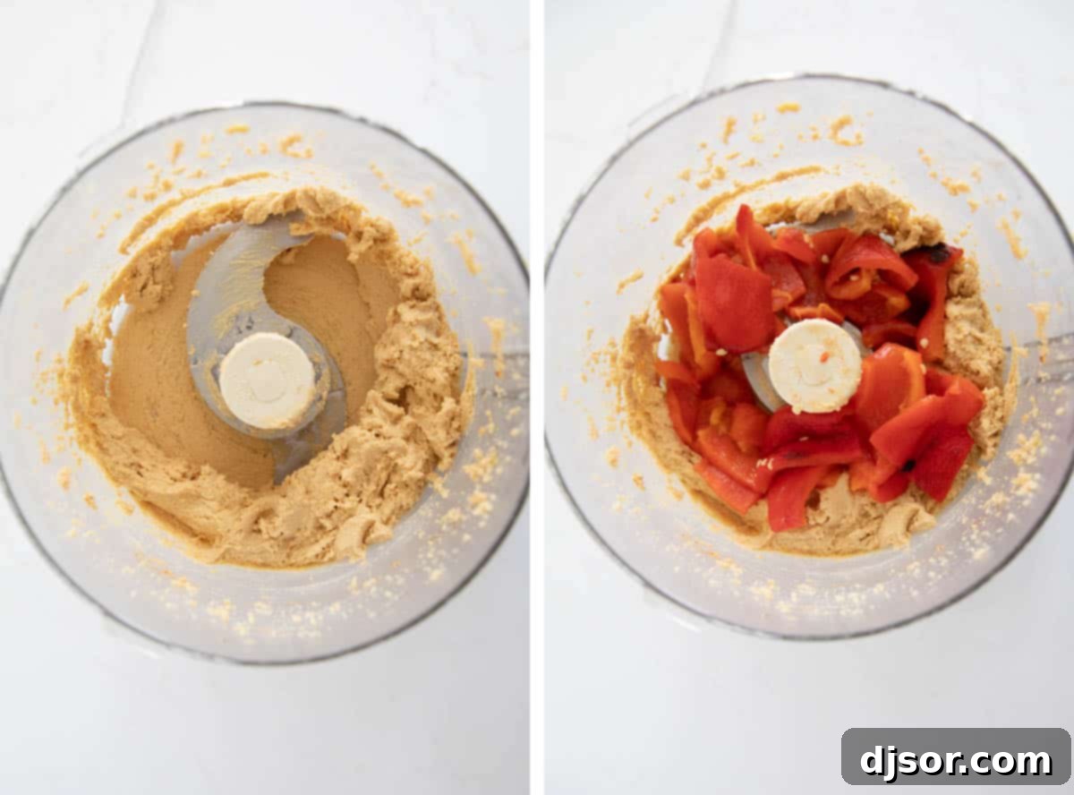 All the ingredients being blended in a food processor to create the roasted red pepper hummus. Ingredients being processed in a food processor to create smooth roasted red pepper hummus.