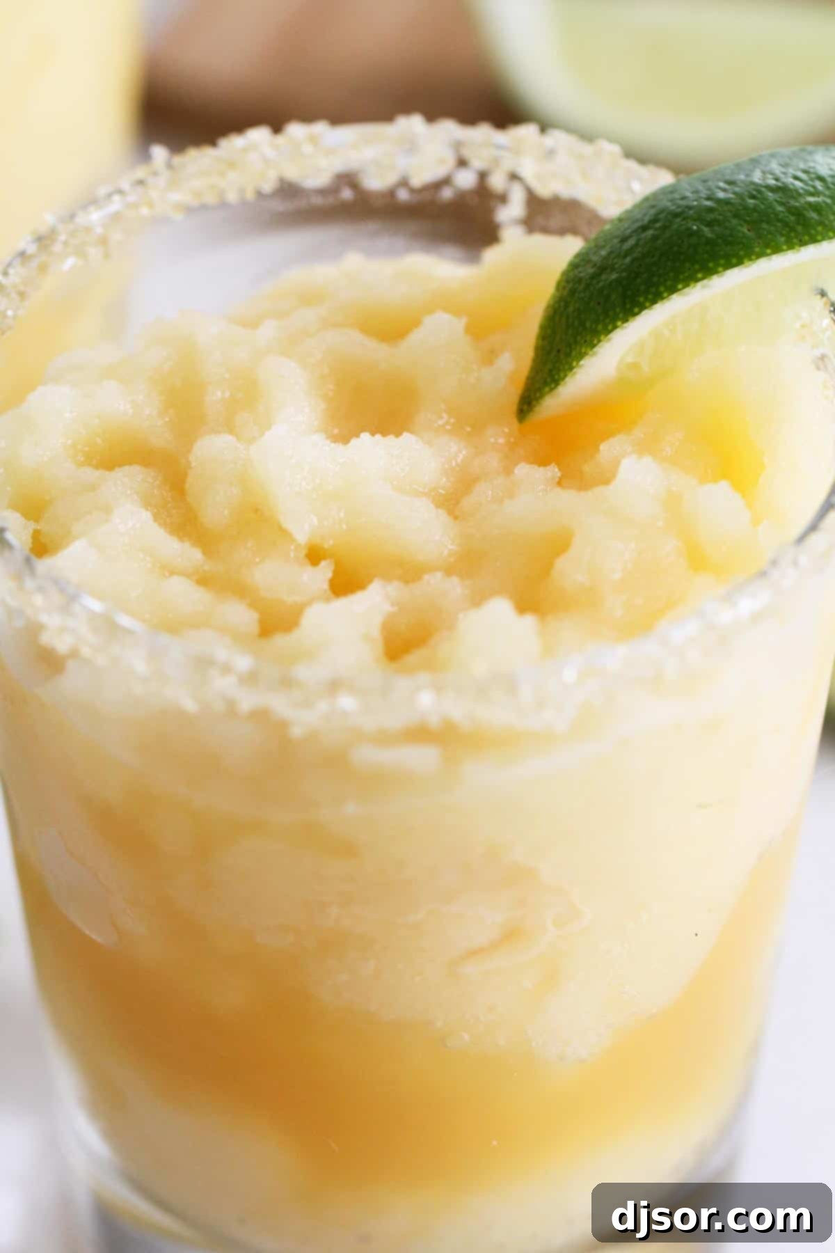 A little bit tart, a little bit sour, and a little bit sweet, these Virgin Frozen Margaritas come together in just minutes and are super family friendly! Virgin Frozen Margaritas with sugar on the rim of the glasses