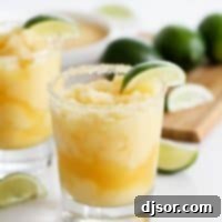 Refreshing Virgin Frozen Margaritas 2 Virgin Frozen Margaritas with lime slices