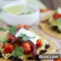 Vegetarian Tostadas made with black beans, spaghetti squash, onions, and tomatoes.