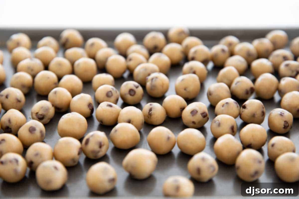 This Chocolate Chip Cookie Dough Dip is a sweet cream cheese dip that is loaded with balls of egg-free cookie dough. Serve with graham crackers, vanilla wafers, or pretzel crisps. small balls of chocolate chip cookie dough