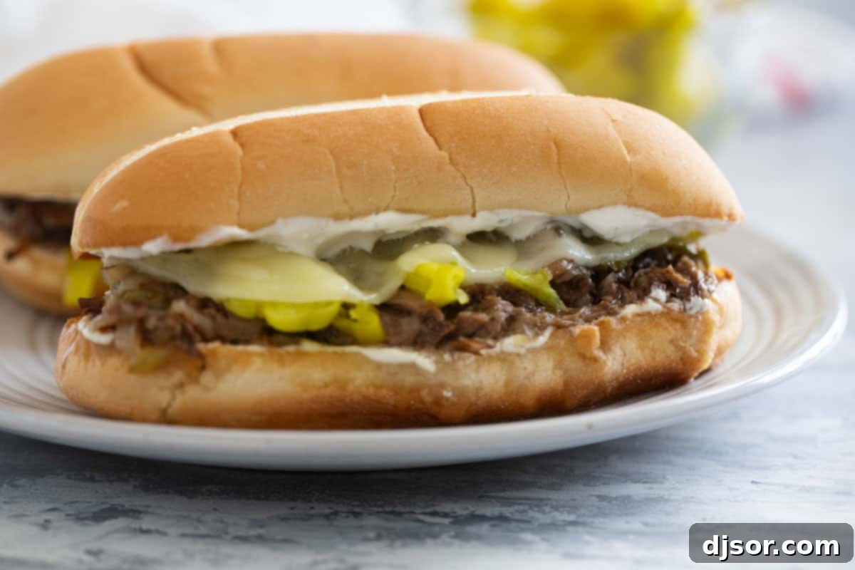 Chicago's Iconic Italian Beef 2 Italian Beef Sandwiches on a plate, ready to be served.