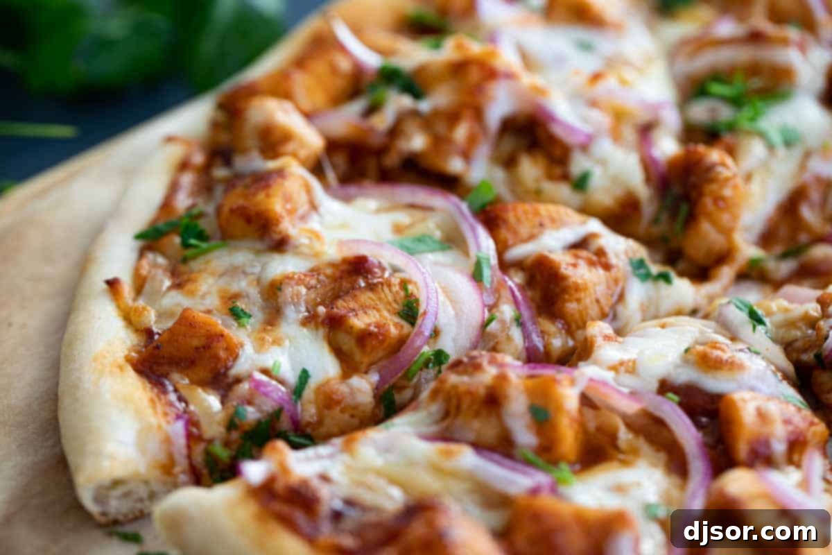 A delicious slice of homemade BBQ Chicken Pizza ready to be enjoyed