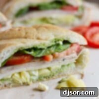 Mediterranean Turkey Artichoke Sub 2 Turkey sub cut into serving portions.