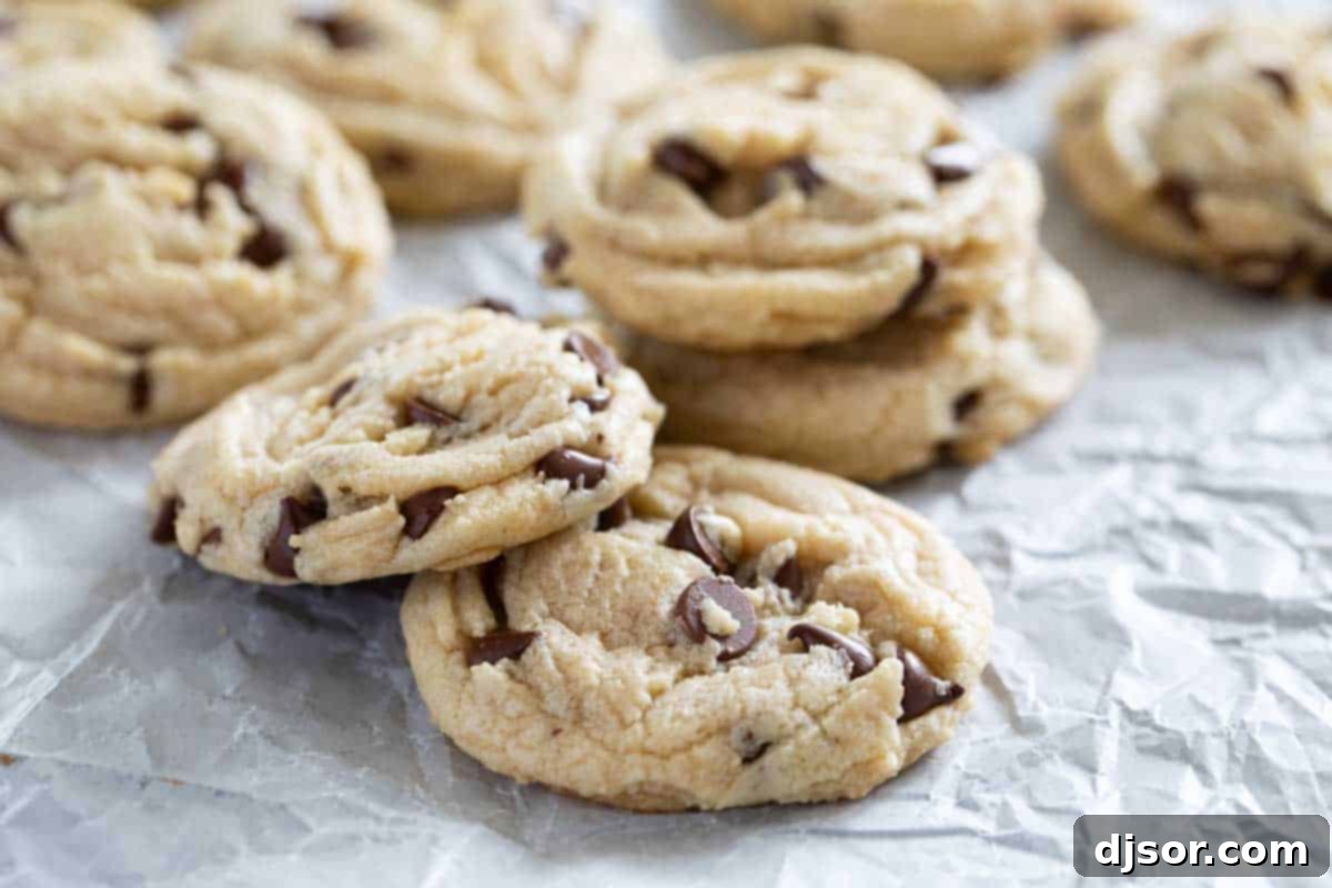 A stack of our ultimate Toll House Chocolate Chip Cookies. A stack of freshly baked, golden-brown Toll House Cookies.