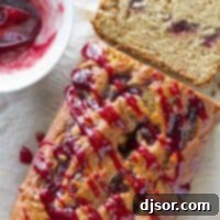 Peanut Butter Jelly Swirl Banana Bread 5 A freshly baked loaf of Peanut Butter and Jelly Banana Bread with jelly drizzled on top