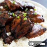 Sticky Honey Soy Glazed Chicken 7 Honey Soy Chicken with parsley and green onions over the top.