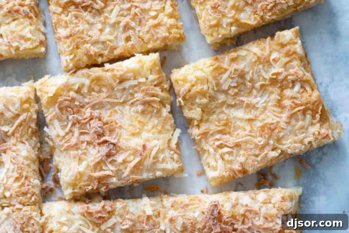 Delicious and easy 4-ingredient coconut bars overhead view of sliced coconut bars ready to be served