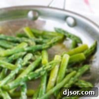 Maple Mustard Glazed Asparagus 3 Maple Mustard Sauteed Asparagus in a skillet, garnished and ready to serve
