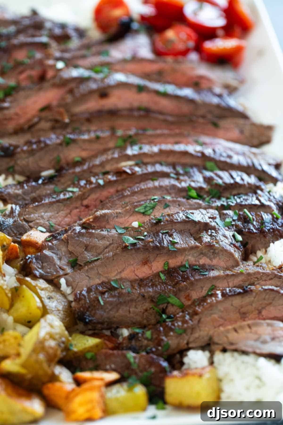 Close-up shot of perfectly sliced Korean Flank Steak, revealing its tender texture and juicy interior, inviting diners to enjoy.