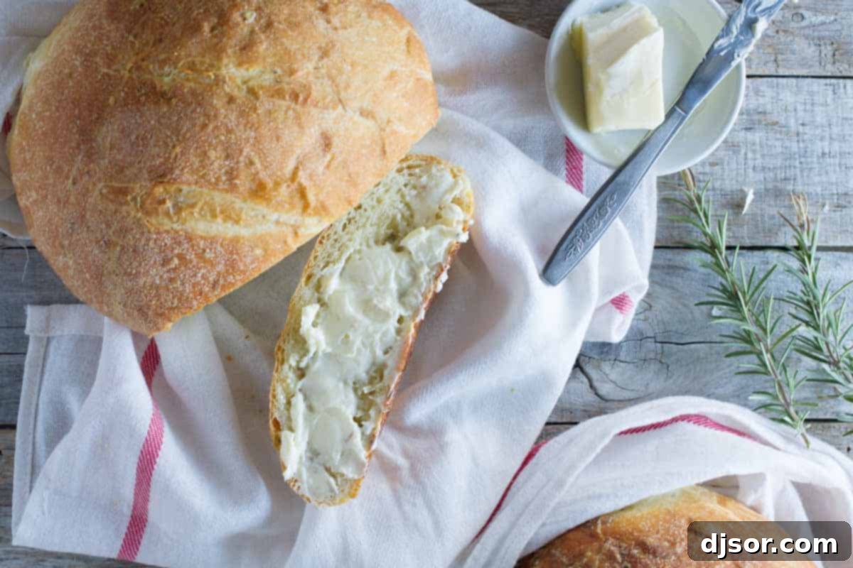 Overhead view of a golden-brown potato bread loaf, indicating its tender crumb and inviting crust.