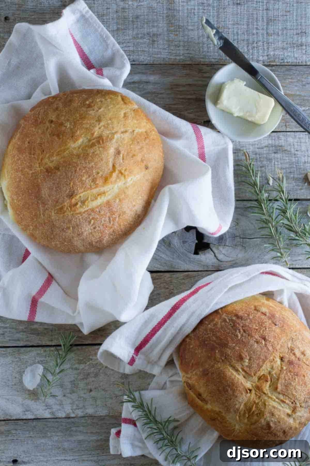 Two beautiful loaves of golden potato bread, showcasing their perfect rise and crust.