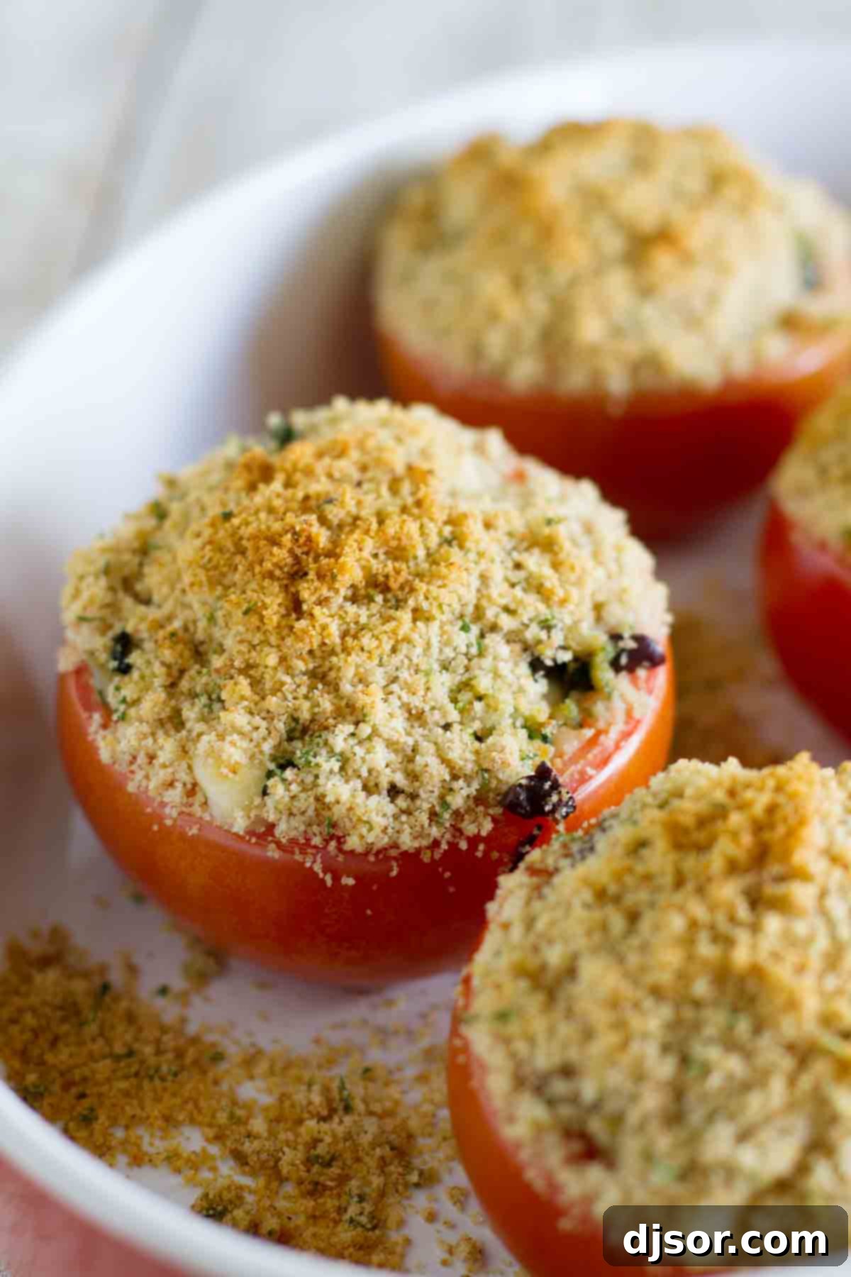 Cheesy Italian Stuffed Tomatoes in a baking dish, ready to be served.