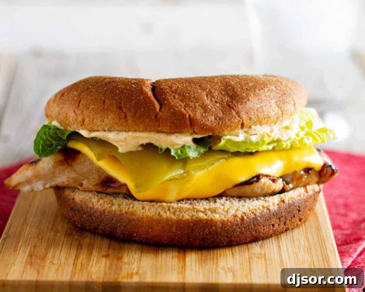 Carl's Jr Copycat Santa Fe Grilled Chicken Sandwich - A perfect homemade grilled chicken sandwich with teriyaki marinade, Santa Fe sauce, and green chile.