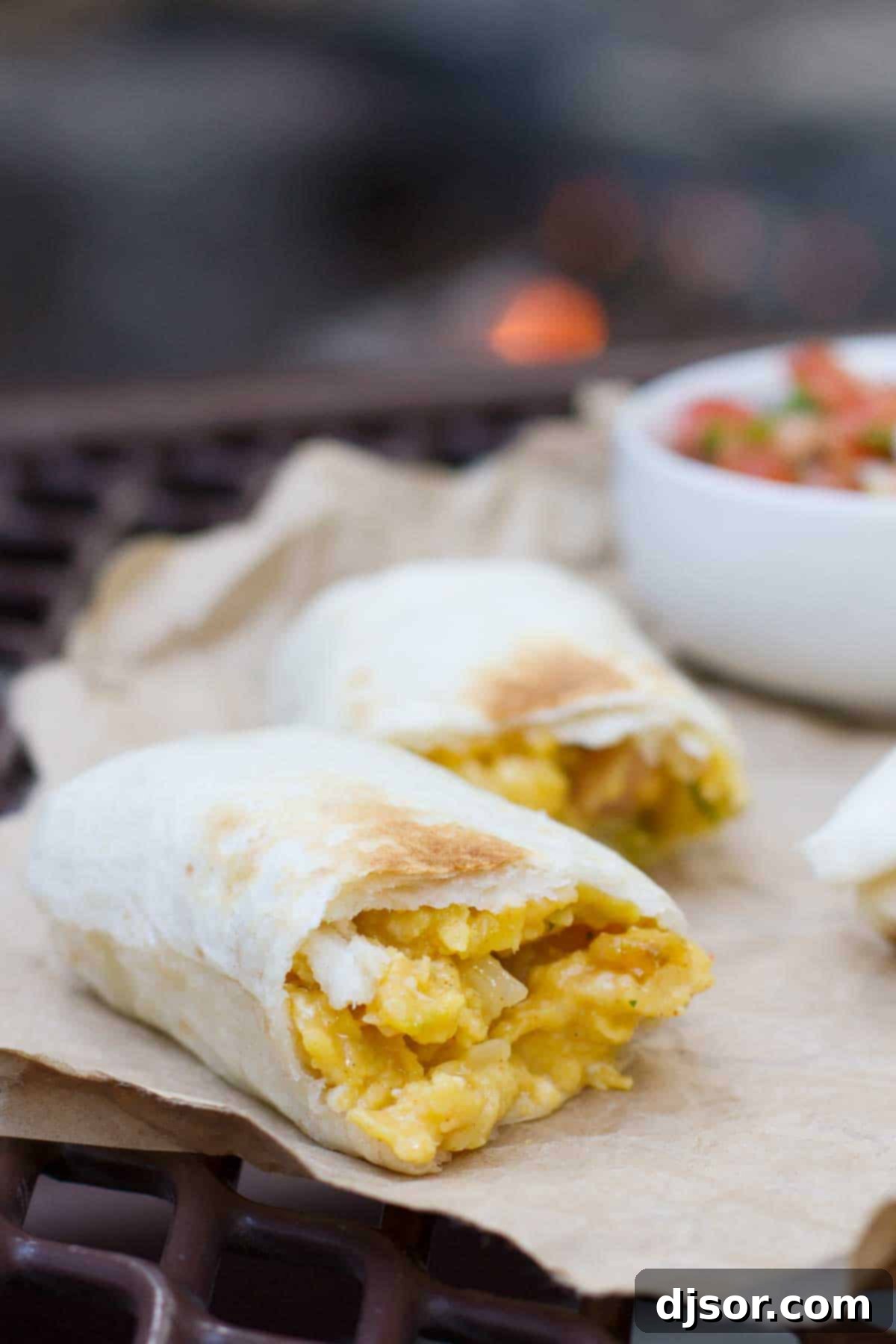 Delicious Campfire Breakfast Burritos cooking over an open fire, ready for a hearty camping meal.