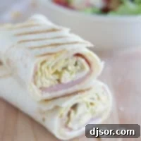 Cordon Bleu Grilled Chicken Wraps 5 Grilled Chicken Cordon Bleu Wrap cut in half to show interior.