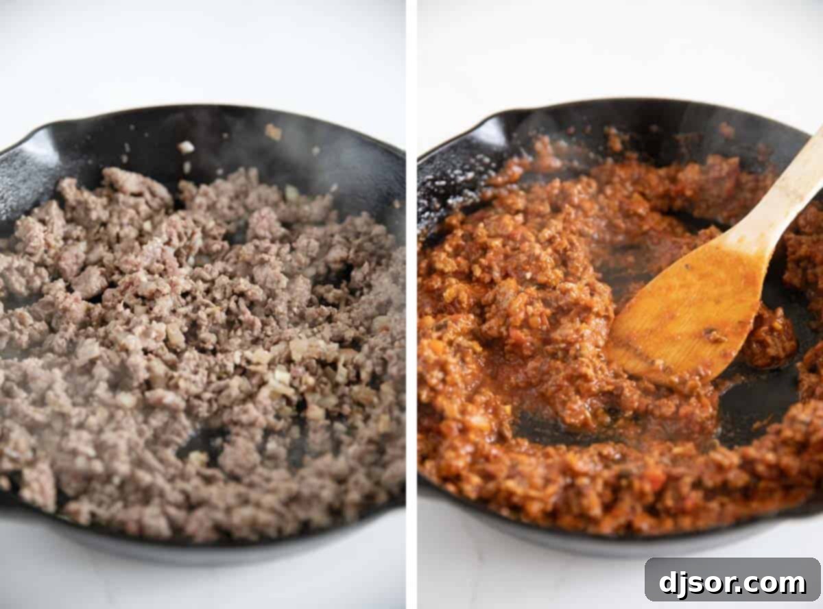 A skillet filled with a rich, browned meat sauce made from ground beef, Italian sausage, and marinara, being prepared for stuffing zucchini boats.