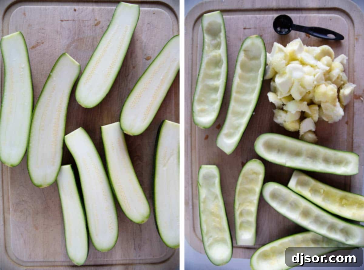Two zucchini halves, perfectly hollowed out with the inner flesh scooped away, ready to be filled with the savory meat mixture.