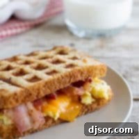 Waffled Breakfast Grilled Cheese Sandwich Recipe - A delightful breakfast with scrambled eggs, bacon, and cheese cooked in a waffle maker.