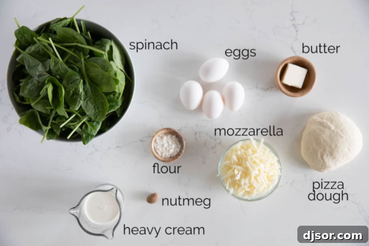 Breakfast meets dinner with this Egg Pizza with Creamed Spinach which tops pizza dough with creamed spinach and a perfectly cooked egg. Ingredients for Egg Pizza with Creamed Spinach laid out on a kitchen counter, showcasing fresh spinach, eggs, cheese, and butter.