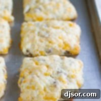 Cheddar Sausage Biscuits: A Southern Comfort Twist 5 Cheddar Sausage Biscuits on a baking tray.