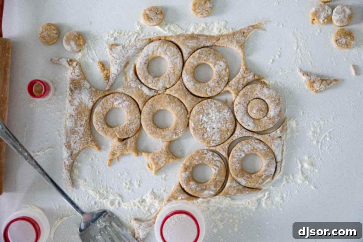 How to Make Apple Cider Donuts From Scratch: A Detailed Guide Close-up of freshly fried Apple Cider Donuts, ready for glazing