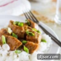 Sticky Sesame Slow Cooker Pork 2 Asian Slow Cooker Pork Roast over rice on a plate.