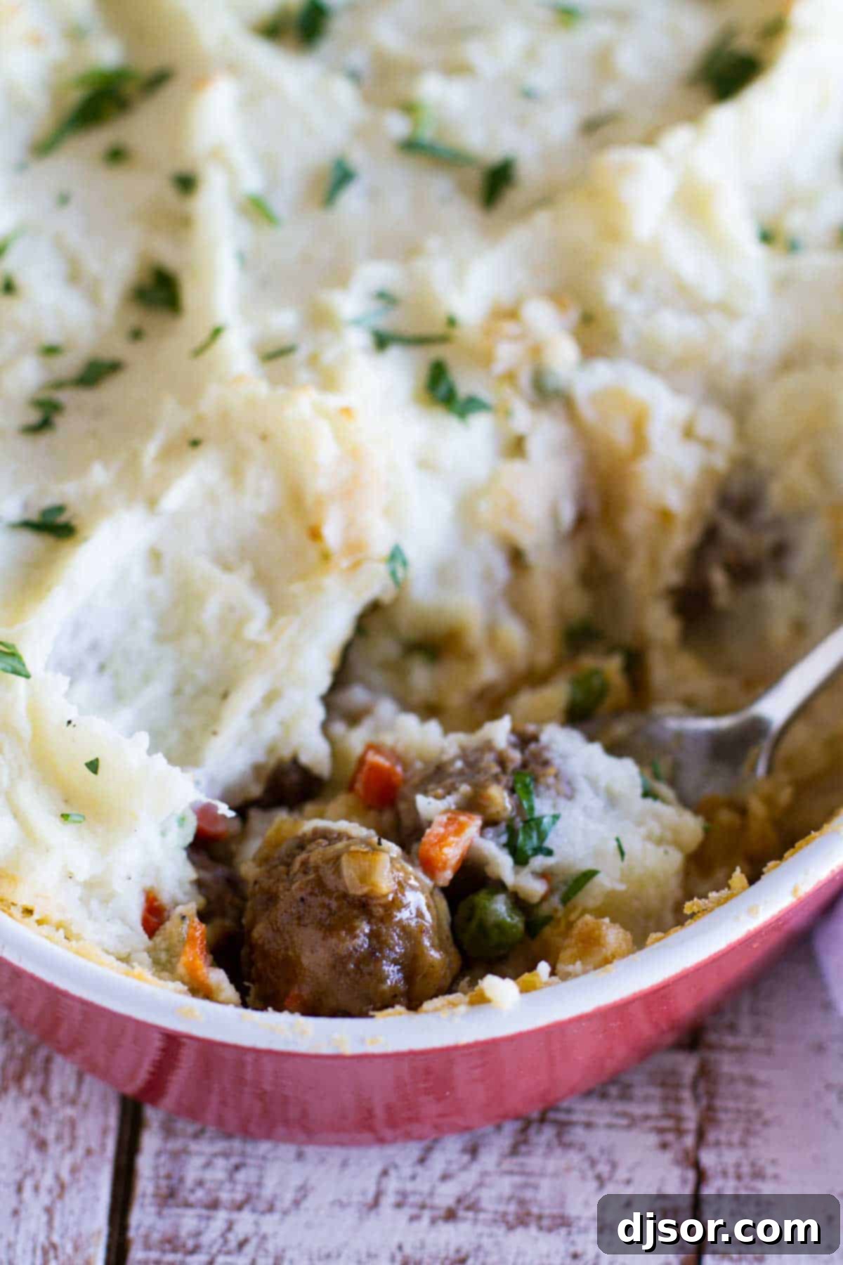 Hearty Meatball Cottage Bake 2 Meatball cottage pie, showing interior with meatballs and vegetables.