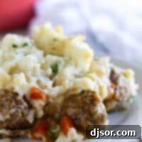 Hearty Meatball Cottage Bake 5 Serving of meatball cottage pie on a plate.