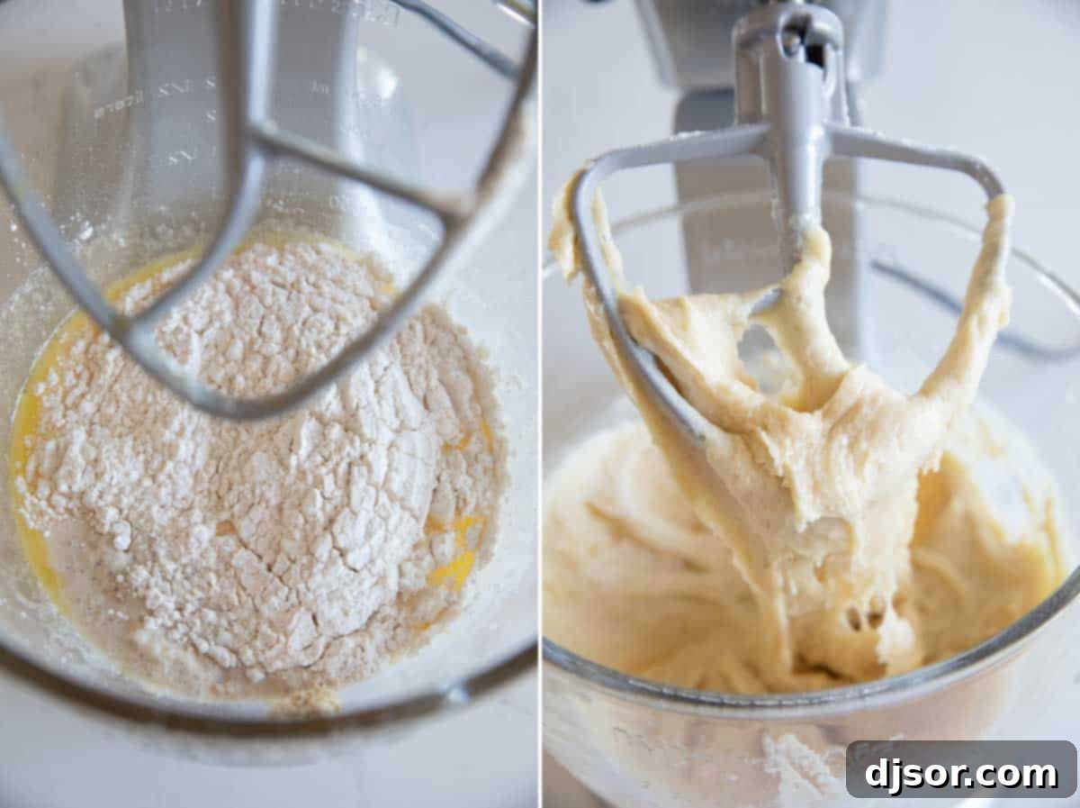 All-purpose flour being gradually added to a sticky brioche dough mixture in a stand mixer bowl with a flat beater, preparing for kneading.