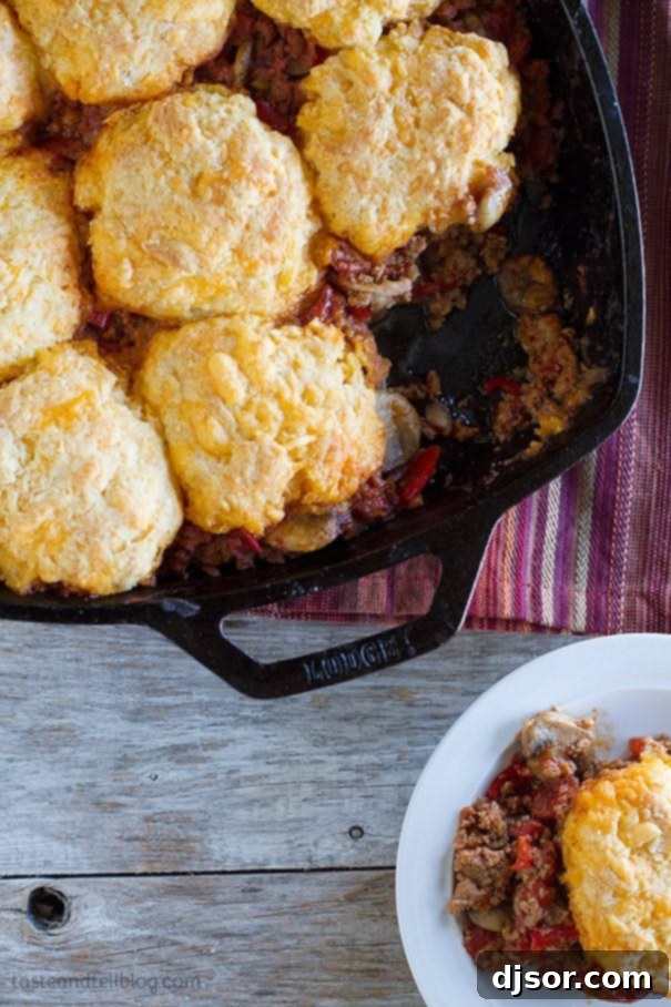 Delicious Skillet Turkey Pot Pie topped with golden cheesy biscuits