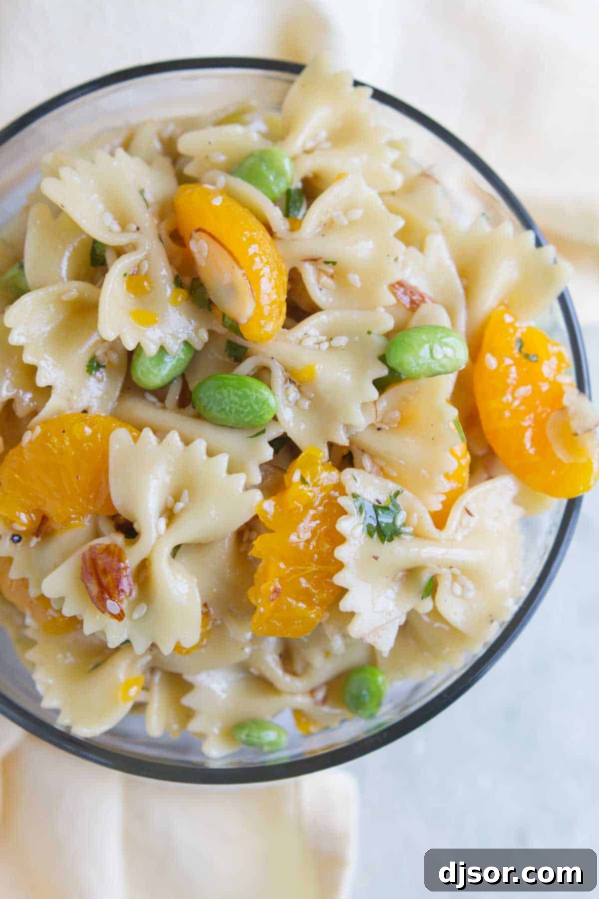 Asian Sesame Noodle Salad 3 Overhead view of Oriental Pasta Salad with edamame and oranges.