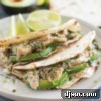 Slow Cooker Chicken Tacos with avocado and cilantro.