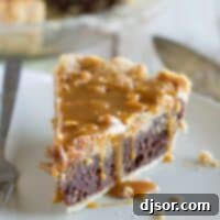 Decadent Peanut Butter Fudge Pie 2 slice of peanut butter fudge pie topped with salted peanut butter caramel.