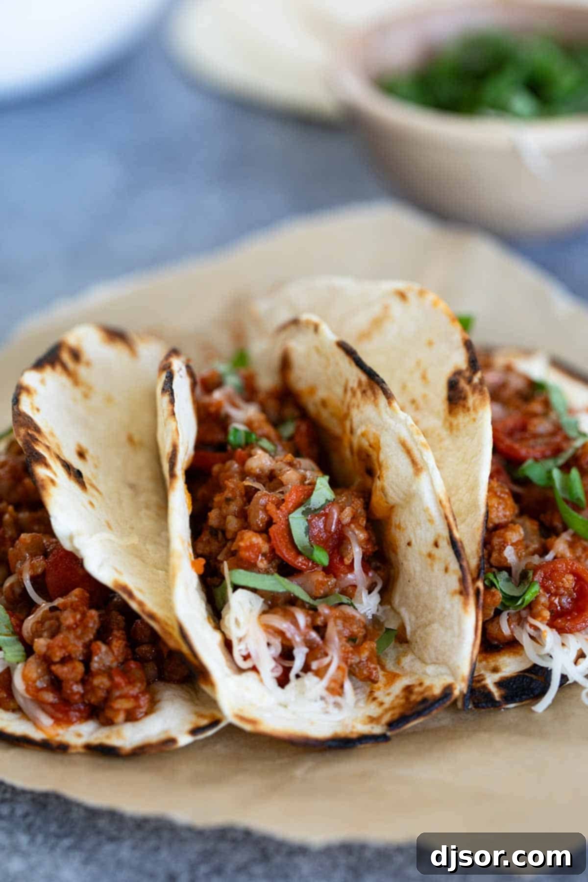 Pizza Tacos with sausage and pepperoni in flour tortillas.