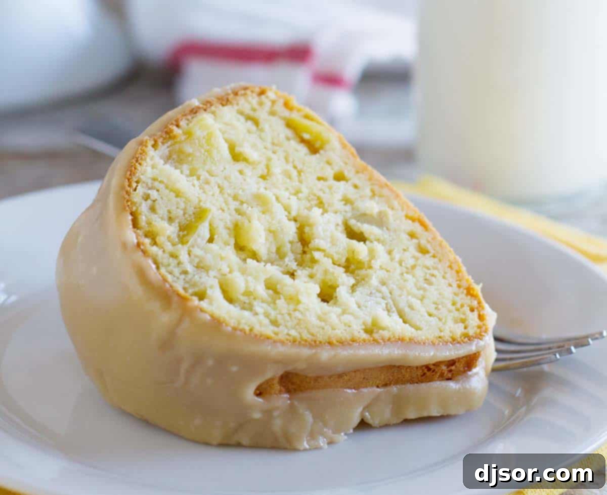 This easy, yet impressive looking Apple Bundt Cake with Caramel Frosting is perfect to serve to holiday guests. Don’t skip the caramel frosting - it totally makes this cake! slice of Apple Bundt Cake with apple chunks