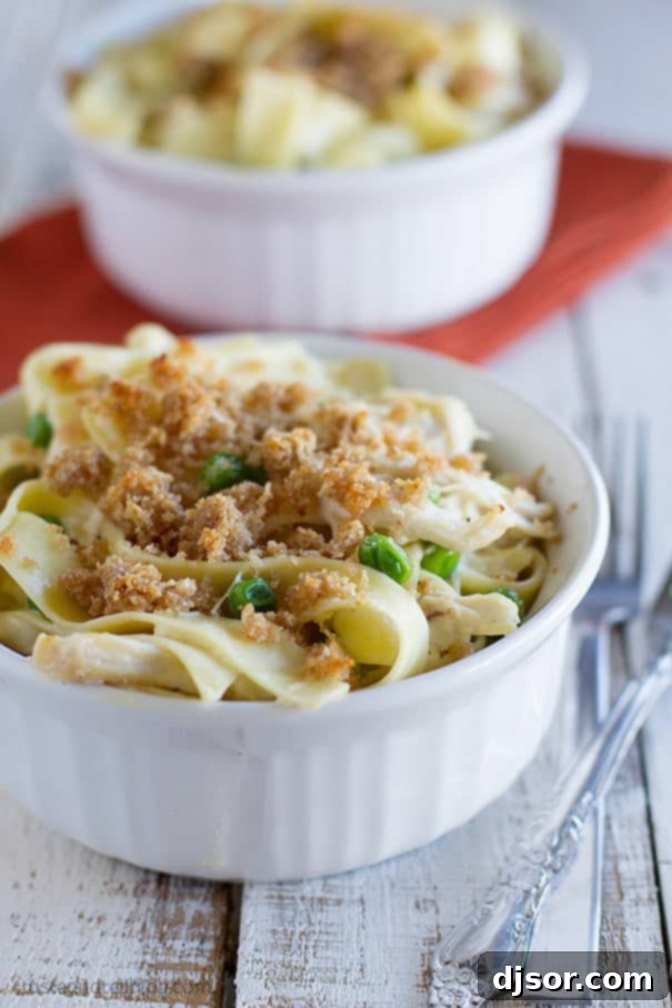 Creamy Garlic Parmesan Chicken Pasta ready to be served from a casserole dish