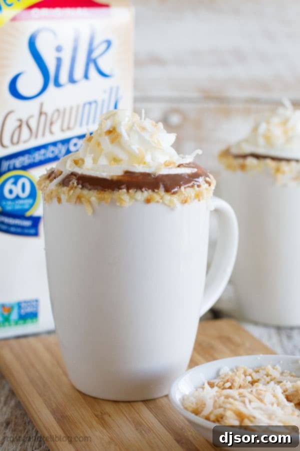 Creamy Cashew Coconut Hot Chocolate 7 The perfect way to warm up on a cold day: a mug of Cashew Coconut Hot Chocolate with whipped cream
