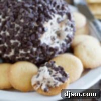 Cannoli Cheese ball on a plate surrounded by vanilla wafers.