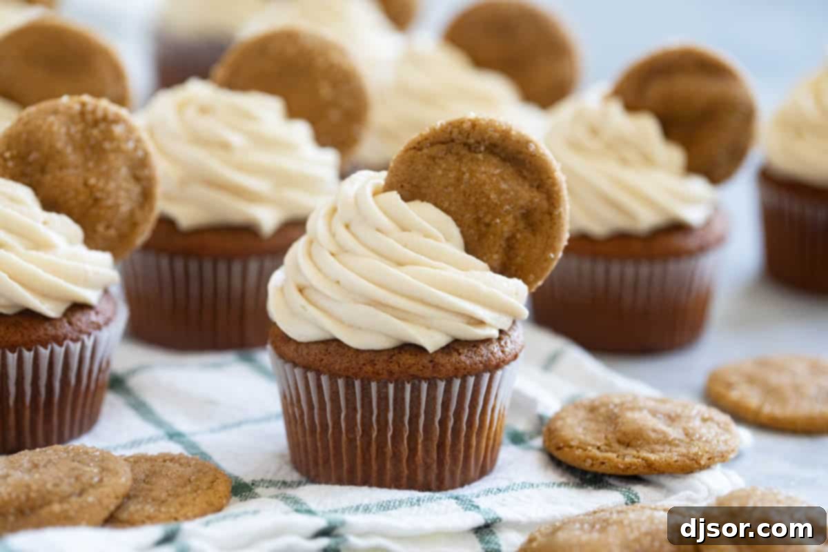 Warm Spiced Gingerbread Treats 2 Gingerbread cupcakes topped with soft ginger cookies.
