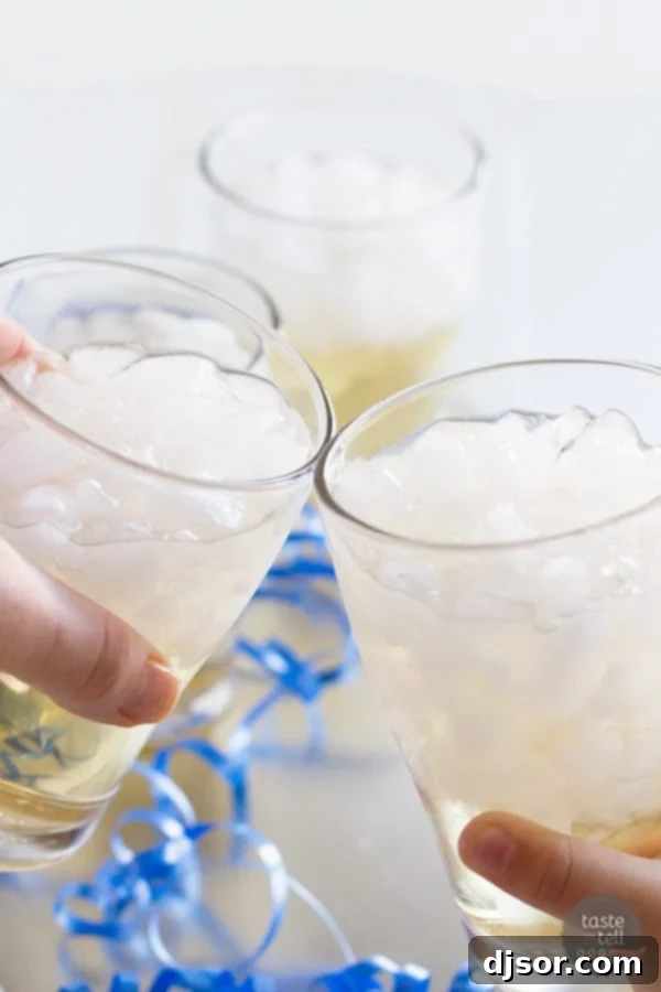 An easy, non-alcoholic drink that is great for any celebration. Features a glass of punch with a straw and garnishes.