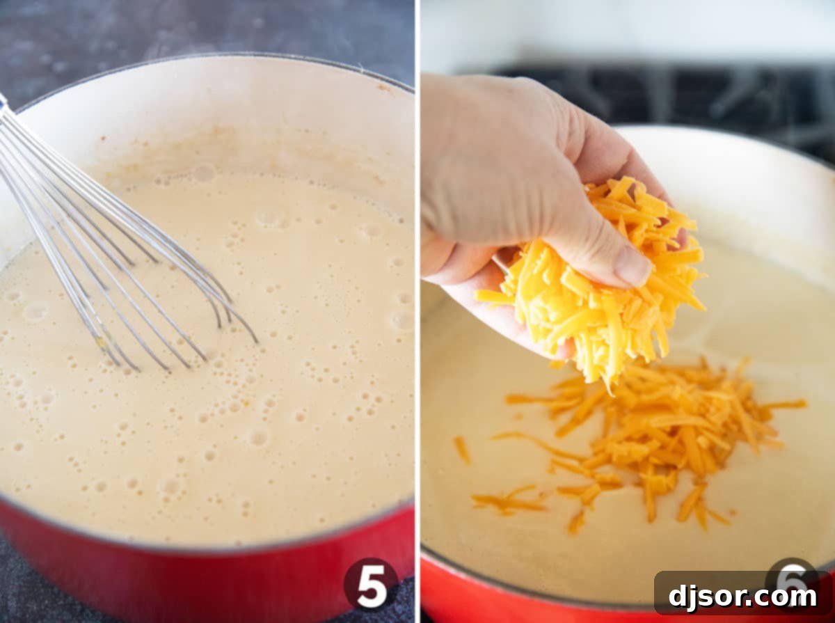 Shredded sharp cheddar cheese being slowly added in batches to the simmering creamy soup in a large pot, with a whisk nearby to ensure smooth melting and incorporation.