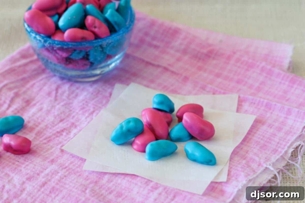 A homemade version of Jordan Almonds - whole almonds coated in a candy coating. blue and pink homemade Jordan almonds beautifully arranged