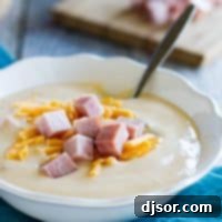 Ham and Cheese Cauliflower Bisque 2 bowl of cauliflower soup topped with ham and cheese