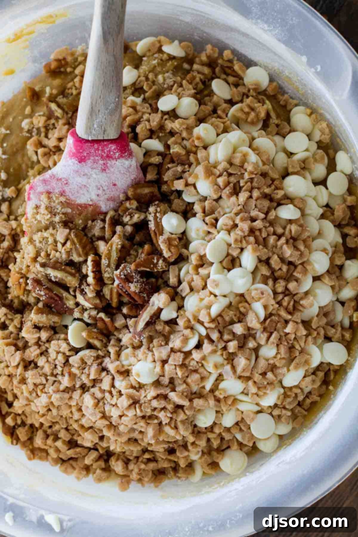 Mixing Ingredients for Easy Blondies Blondie ingredients being mixed in a large bowl, showing melted butter, brown sugar, and flour blend.